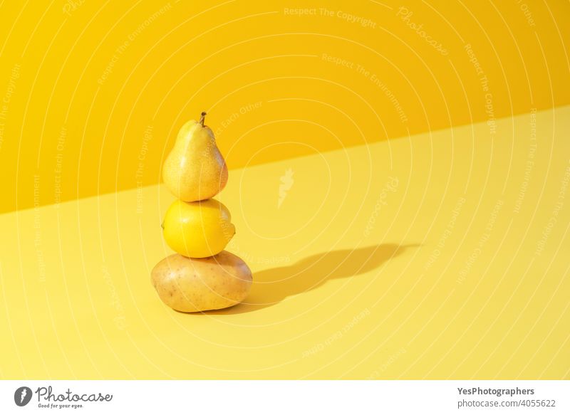 Yellow fruits and vegetables, isolated on a colored background. abstract backdrop bright citrus colorful colors copy space creative cut out diet food fresh