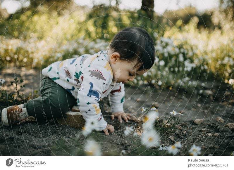 Child playing outdoors childhood Playing Nature Authentic Spring Spring fever Human being Happy Lifestyle Caucasian Happiness Joy Day Colour photo Exterior shot