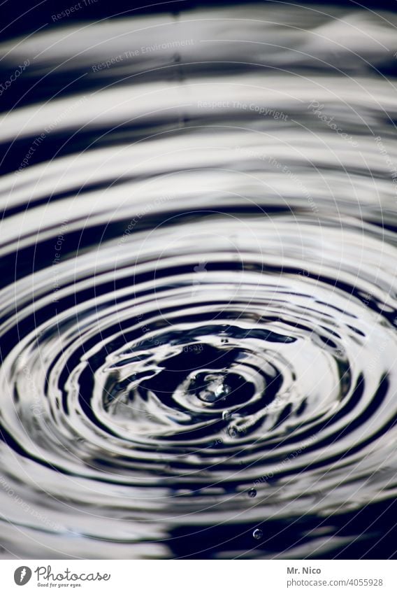 water's surface Surface Wet Whirlpool Surface tension Drops of water Water Circle Glass Gray Tumbler refresh Suction Fresh Reflection Damp Spiral
