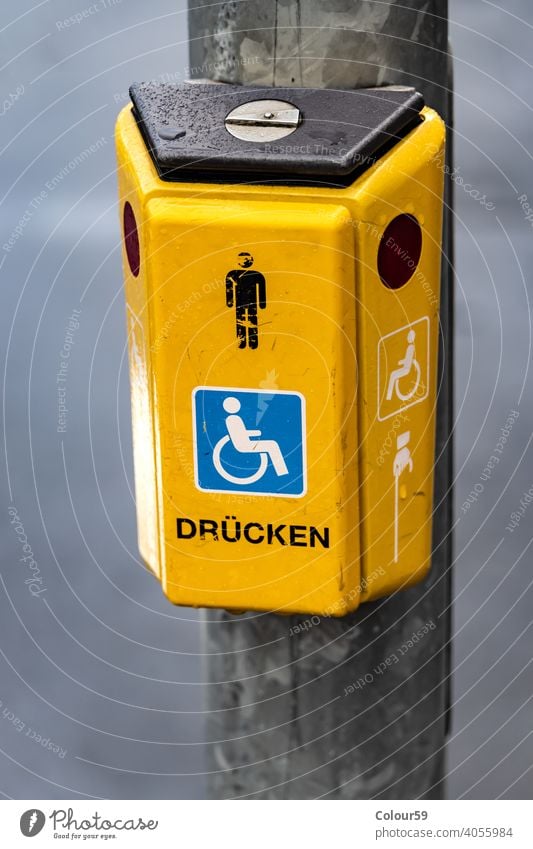 Button on a traffic light yellow box symbol sign safety city street stop button security car control urban road signal warning push crosswalk danger equipment