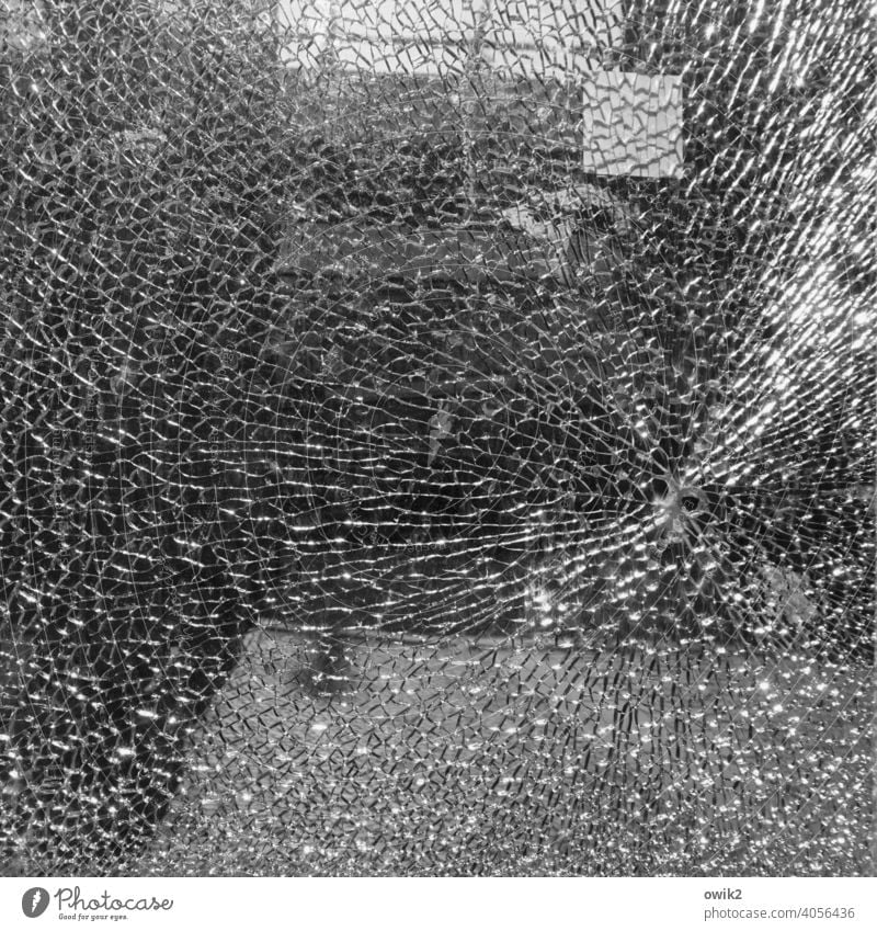 target glass break Window pane Broken Smashed window Deserted Structures and shapes Pattern Abstract Exterior shot Black & white photo Target Shop window Pane