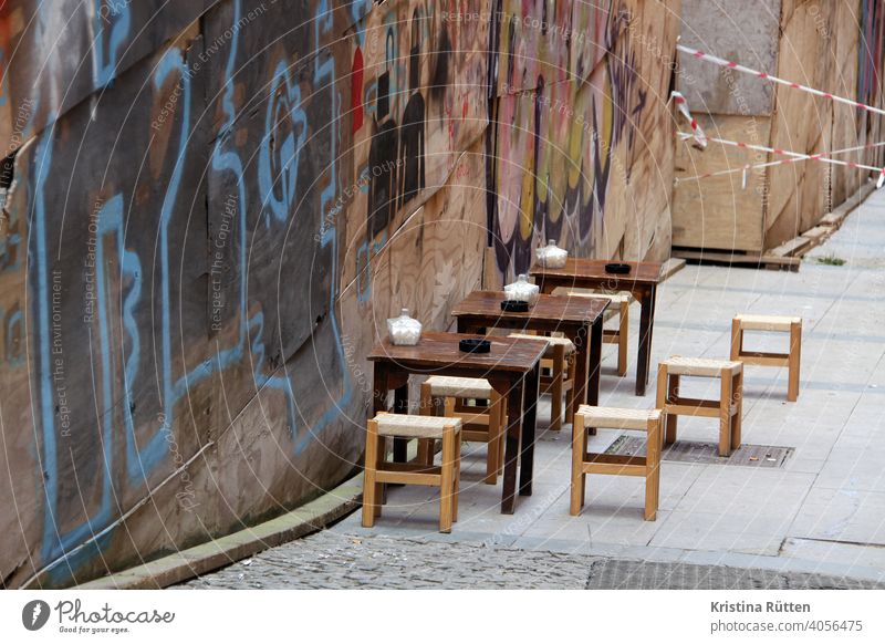 café terrace in istanbul tables Stool Café Restaurant Terrace Ashtray Sugar sugar cans out Sit Wall (building) Graffiti barrier tape Gastronomy Turkish Turkey