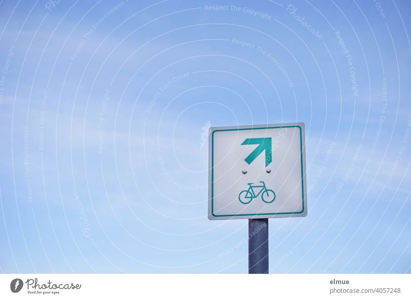 A square sign in front of a blue sky shows a bicycle and an arrow pointing upwards to the right / Pictogram / Orientation cycle path Cycling Signage Sky