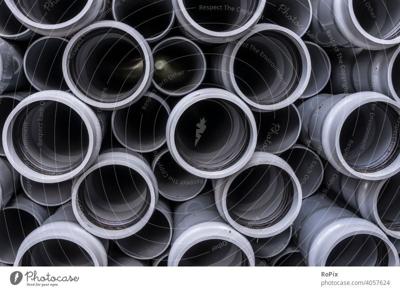 Stack of plastic water pipes. Water Straws tube Hose interdiction variegated Rubber reinforced technique microplasty Factory company environmental impact Dye