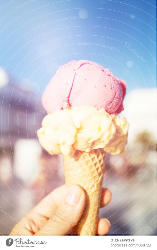 Woman's hand holding ice cream in waffle cone. gelato summer fun happy food dessert ice-cream sweet woman cold delicious snack tasty icecream soft natural