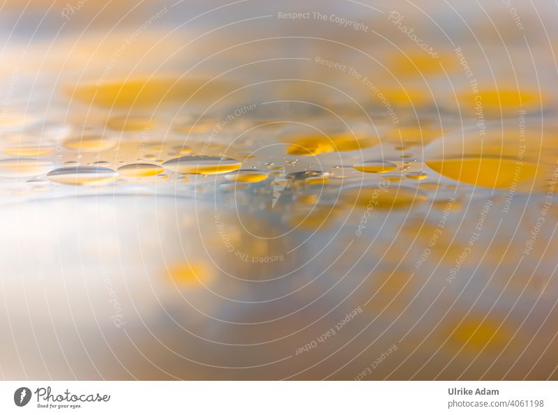 Oil on water Cooking oil Water background Yellow Soft Delicate Abstract Close-up Detail Deserted Structures and shapes blurriness Colour photo