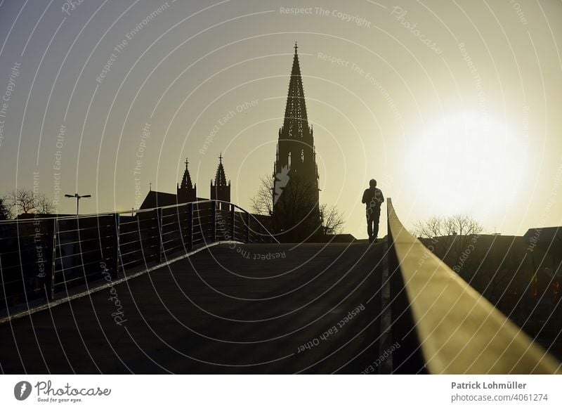 Radiance munster of freiburg Spring Silhouette Belief Lonely Hope religiousness come into bloom Relief Human being Man Shadow Church sunset off Bridge