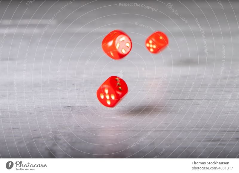the dice have fallen, red dice fall onto a grey wooden board Abstract background Background Abstract backgrounds Bets Invoice Black blurriness hazy bokeh