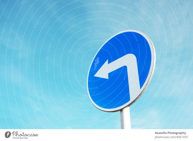 Blue road sign meaning turn to the left design icon concept information arrow attention blue care caution circular conceptual direction directional diversion