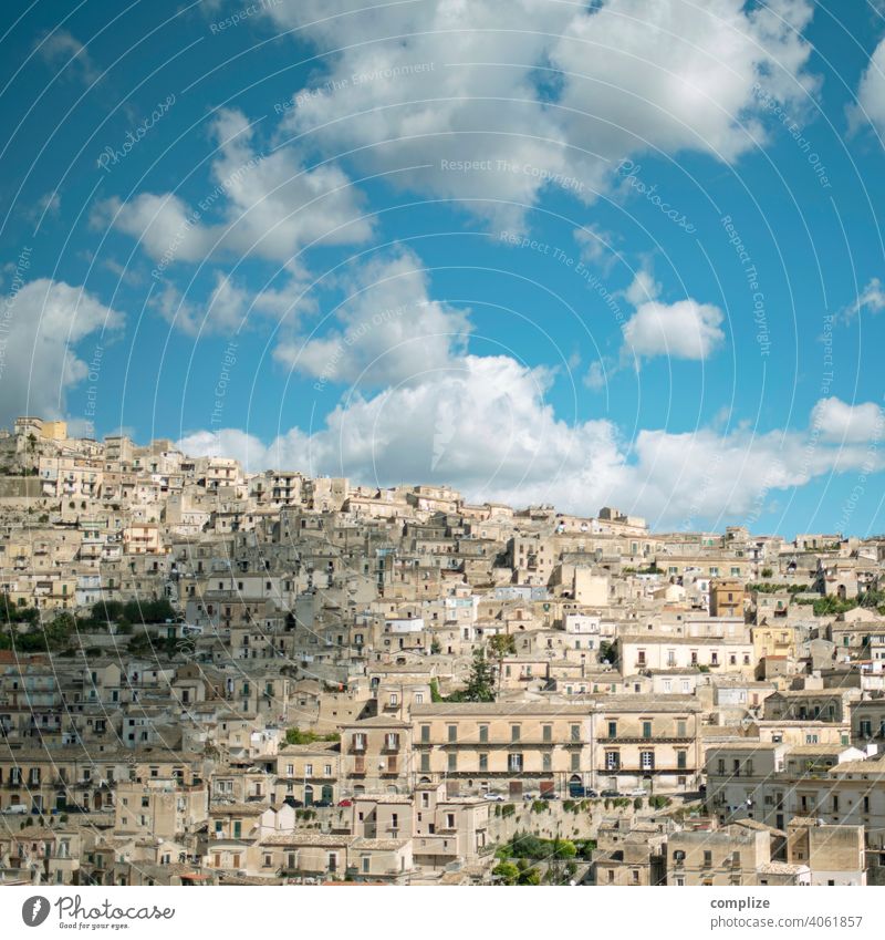 Modica Sicily Hill Tourist Attraction Blue sky modica Sky Clouds Patina Ancient Town Old town Historic Italy Narrow house to house houses Mountain Inhabited