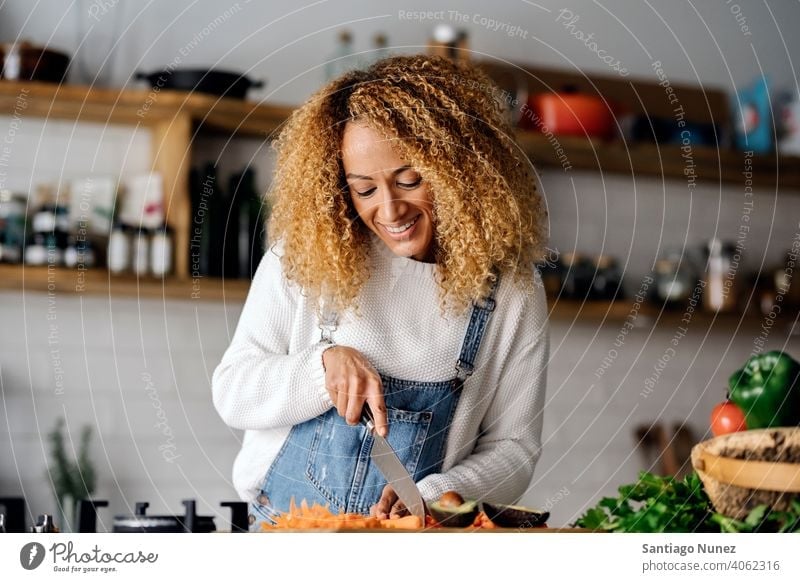Woman preparing food in kitchen. middle age couple love cooking home cozy caucasian relationship female happy person stove woman alone beautiful girl smiling