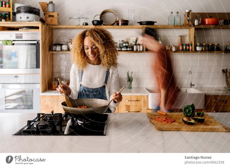 Couple preparing food in kitchen. middle age couple love cooking home cozy caucasian relationship female happy person stove woman beautiful girl smiling two