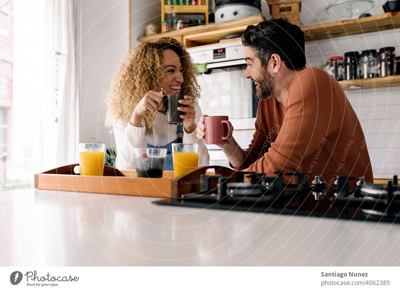 Couple having breakfast in kitchen. middle age couple love cooking home cozy caucasian relationship preparing female happy person stove woman beautiful girl