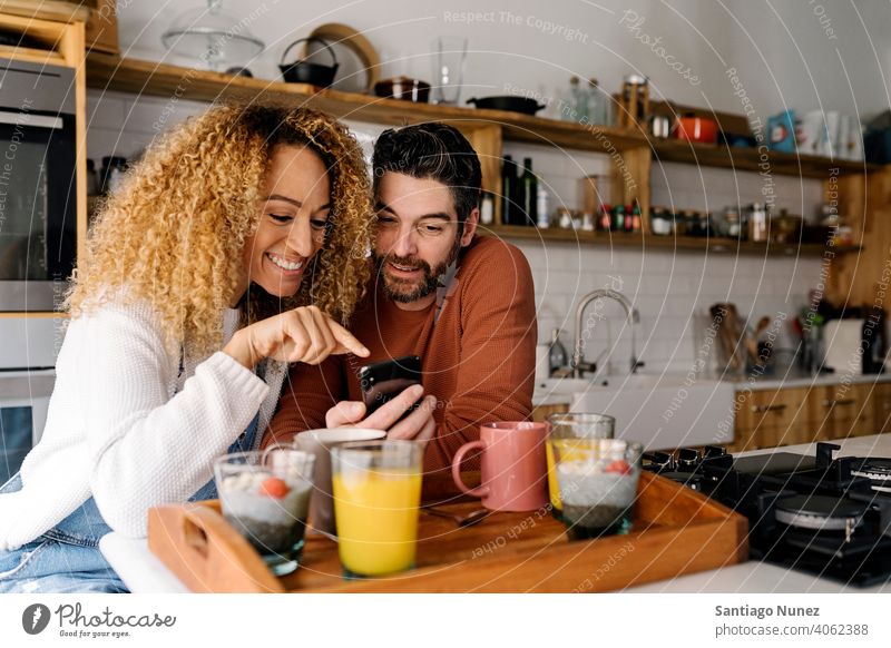 Couple having breakfast in kitchen. middle age couple love cooking home cozy caucasian relationship preparing female happy person stove woman beautiful girl