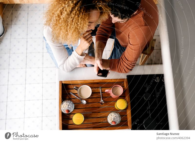 Couple talking in kitchen. middle age couple love cooking home cozy caucasian relationship preparing female happy person stove woman beautiful girl smiling two