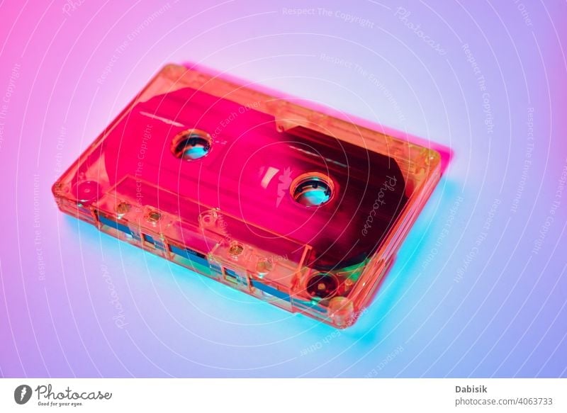 Retro cassette tape on a colorful neon background music record old stereo vintage retro audio sound media style casette 1980 copy mix classic label 1970 80s