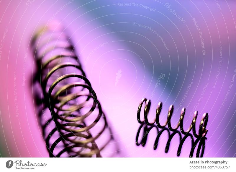 Close up image of two metal strings in blur abstract art blue blurry closeup coiled color composition concentrate create creativity defocused design dna