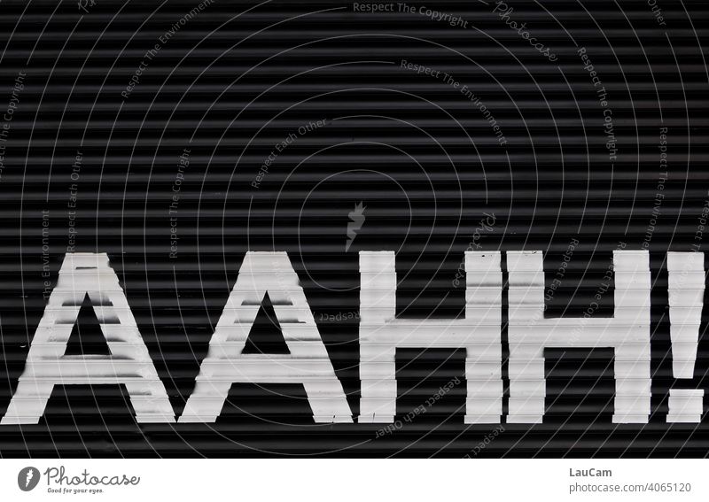 White lettering "AAHH!" on a black background Black black-and-white writing Characters Letters (alphabet) Word Onomatopeia onomatopoeic Typography Text Deserted