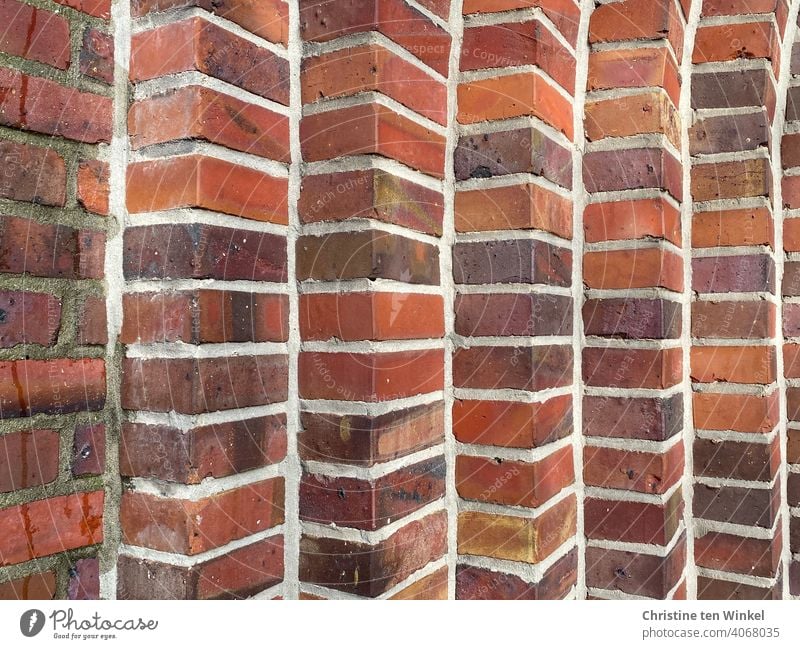 Detail of a brick church portal made of red and brown bricks Church portal Wall (barrier) Facade Wall (building) clinker Brick Brick wall interstices
