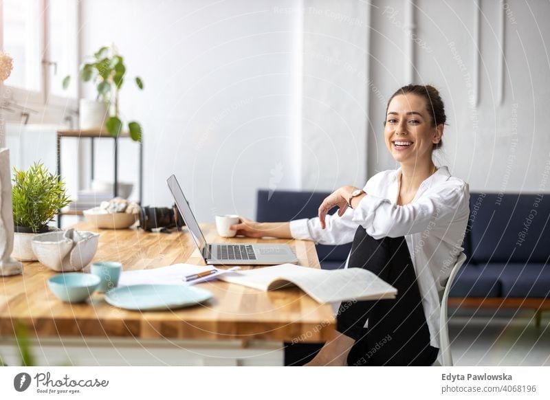 Young female freelancer working in loft office millennials student hipster indoors window natural girl adult one attractive successful people confident person