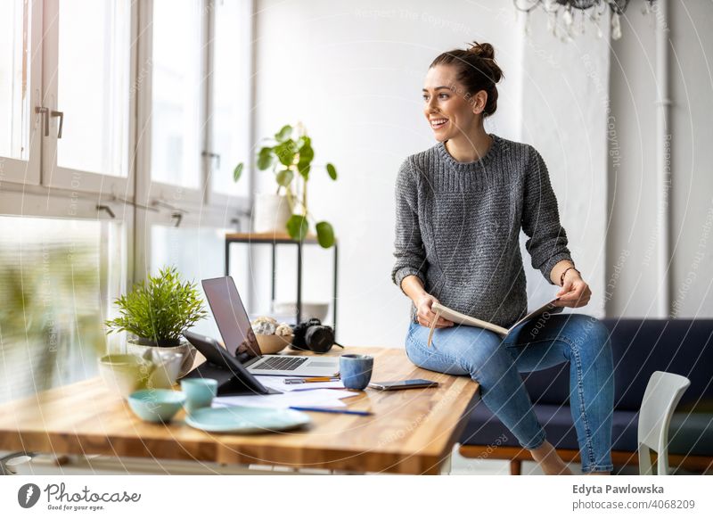 Young female freelancer working in loft office millennials student hipster indoors window natural girl adult one attractive successful people confident person
