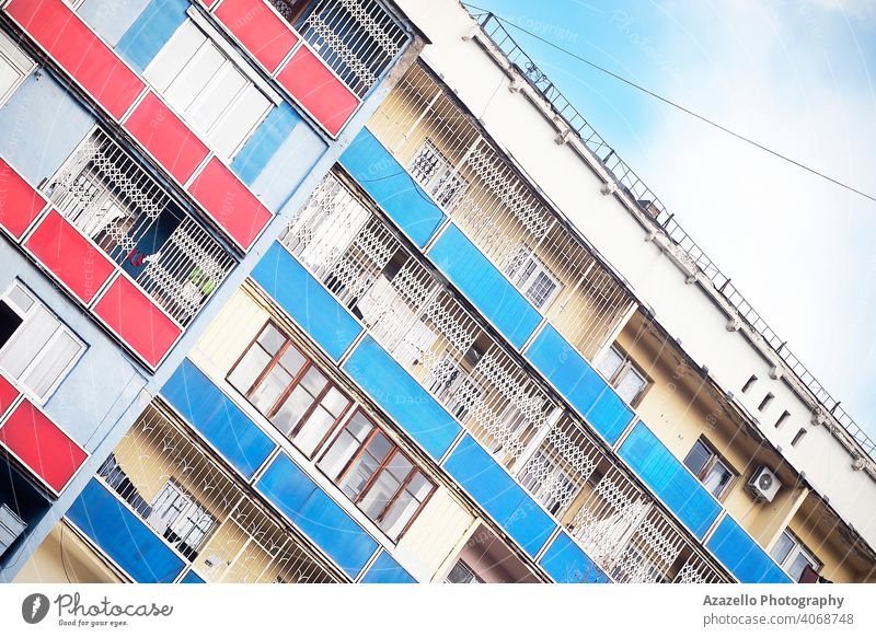 Tilted image of a building with colorful balconies. angle angle perspective angle view apartment architecture balcony block blue city cityscape contemporary