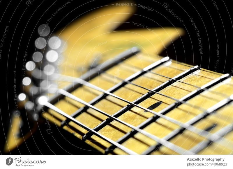 Electric guitar fretboard with a headstock in blur. Maple guitar neck view. activity aim ambition background black blues closeup concert contemporary creative