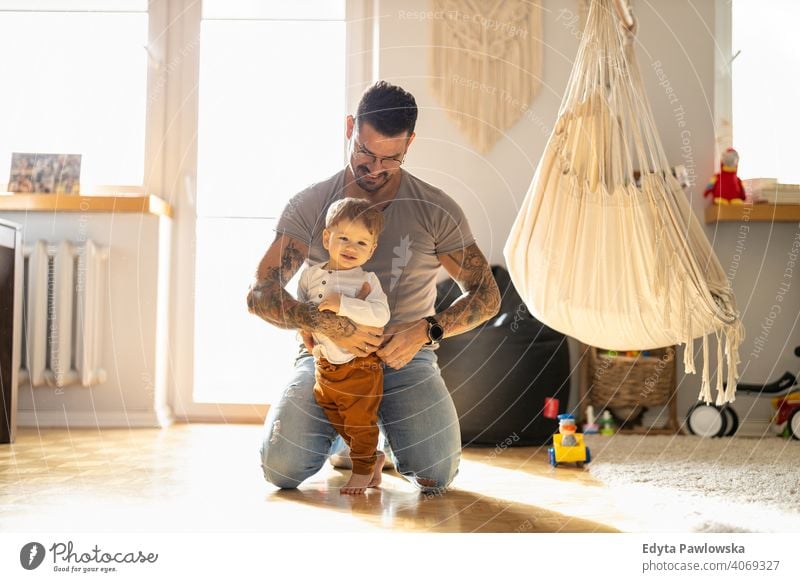 Father playing with his little son at home single parent single dad fathers day fatherhood stay at home dad paternity leave modern manhood family child house