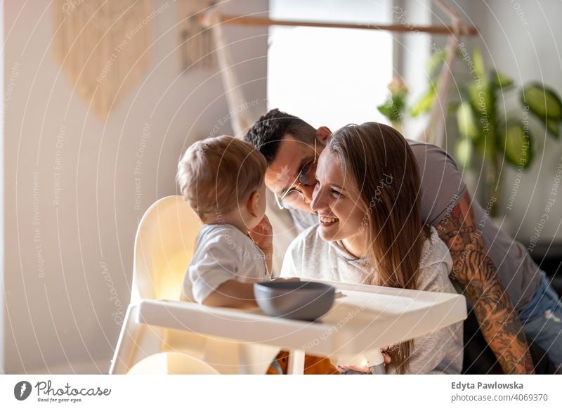 Young family having fun together at home father son child house girl adorable toddler parenting room daughter apartment handsome playing playful infant small