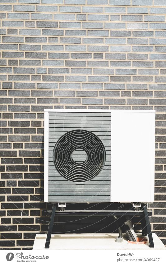 Air-to-water heat pump on a house wall Modern Energy industry Eco-friendly Sustainability Apartment Building Renewable energy Heat generation Ecological