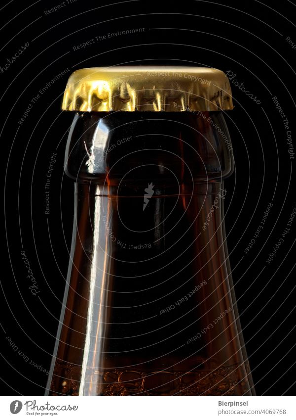 Beer bottle closed with a crown cork Crown cap Crown cork Bottle locked Closure Prongs Tin Glass golden Brown Beverage Drinking close-up unopened Airtight Blow