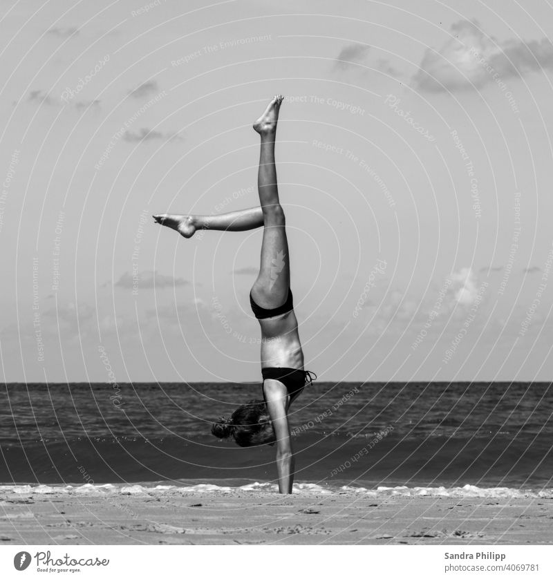 young girl does perfect handstand on beach Beach Handstand Girl Athletic athletic Joy Fitness Sports Exterior shot Lifestyle Sports Training Healthy workout
