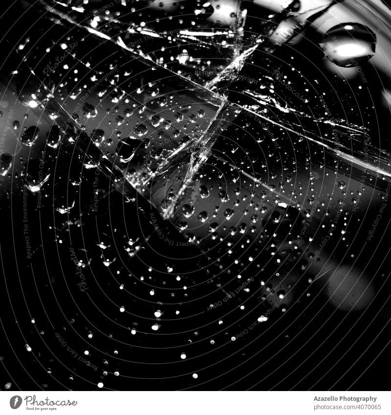 Black abstract backgroound with water droplets on a cracked glass. 2020 abstract art abstract background beam black and white black background black minimalism
