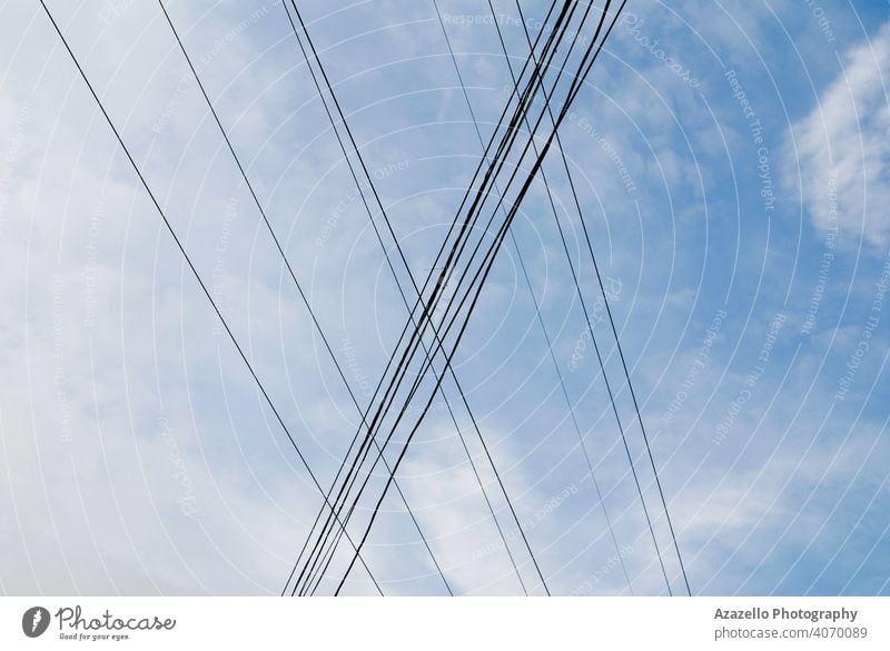 Electricity wires view against the sky abstract architecture background blue cable danger design detail distribution electric electrical electricity energy grid