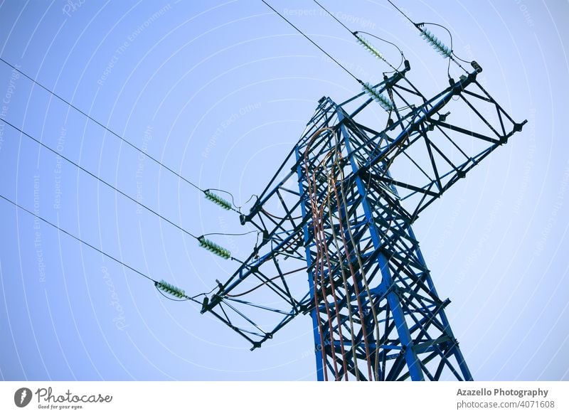 Bottom view of an electricity pylon. blue business cable civilization current danger design distribution ecology electrical energy engineering environment