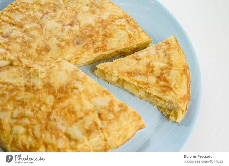 typical spanish potato omelette with onion meal tortilla cuisine dish food homemade appetizer spain egg olive dinner diet espanola mediterranean tapas potatoes