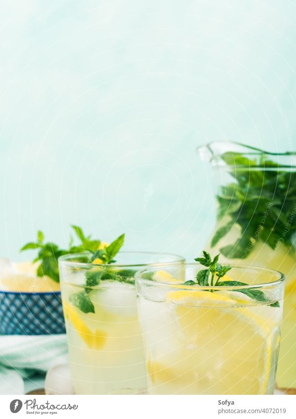 Fresh lemon lemonade in jug and glasses summer infused drink cocktail fruit leaf frozen italian spring juice citrus beverage food vintage mint gin vodka