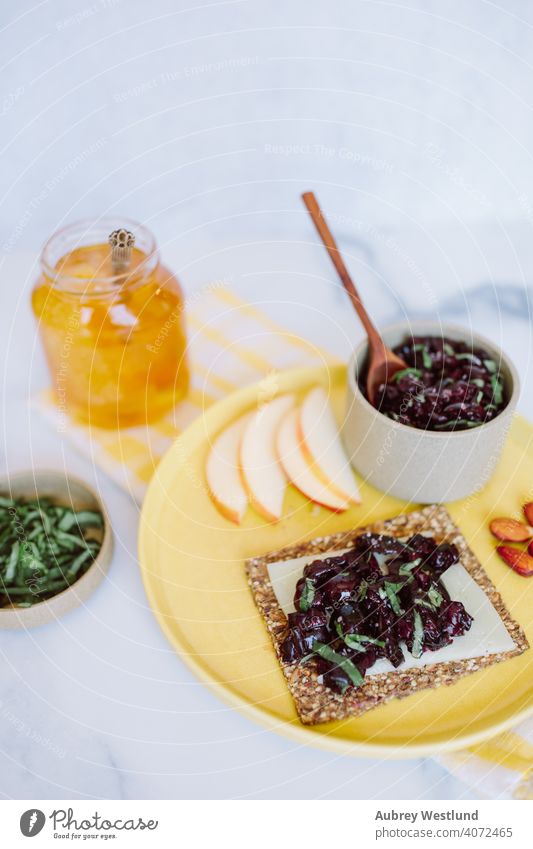 summer cherry relish snack on a seed cracker almonds appetizer appetizers apples assortment background basil berry board charcuterie charcuterie board cheese