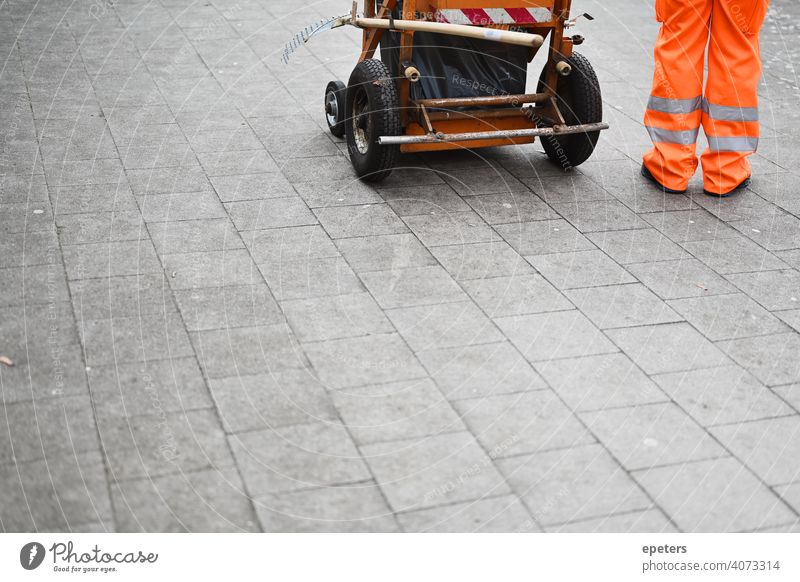 A street cleaner stands next to his cleaning tool cart more adults Boots Broom Open Capitalism City Cleaner Cleaning Cleaning line Clothing color picture