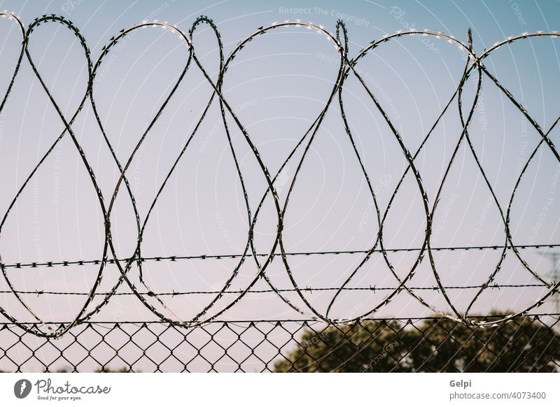 Safety fence of barbed wire metal jail iron protection razor steel sharp security danger barrier Concentration camps refugee camps barbwire refugees border