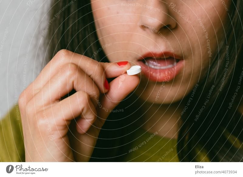 Woman takes a tablet Pill Painkiller medicine Medication Illness Medical treatment Headache migraine painkillers headache tablet