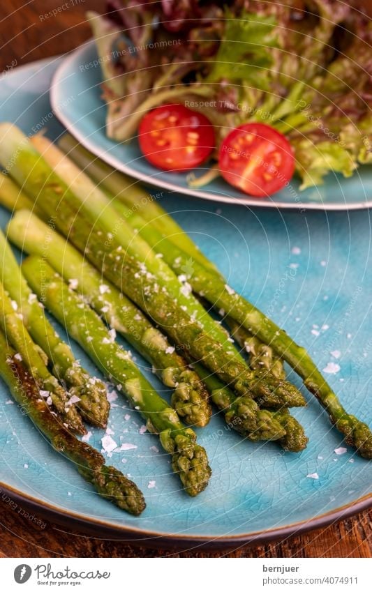 grilled green asparagus on a blue plate Asparagus plank Wood Holiday season seasonal Gourmet string Kitchen Ingredients Asparagus spear Food handle freshness