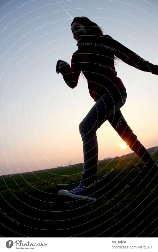 jauntily Walking Silhouette Girl Sunset Shadow Landscape Twilight Sky Chucks Posture Running Back-light Worm's-eye view Athlete fit Fitness Movement Athletic