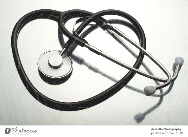 Traditional stethoscope on white reflective background. attributes cardiac cardiology care clinical concept coronavirus covid-19 cure desk device diagnose