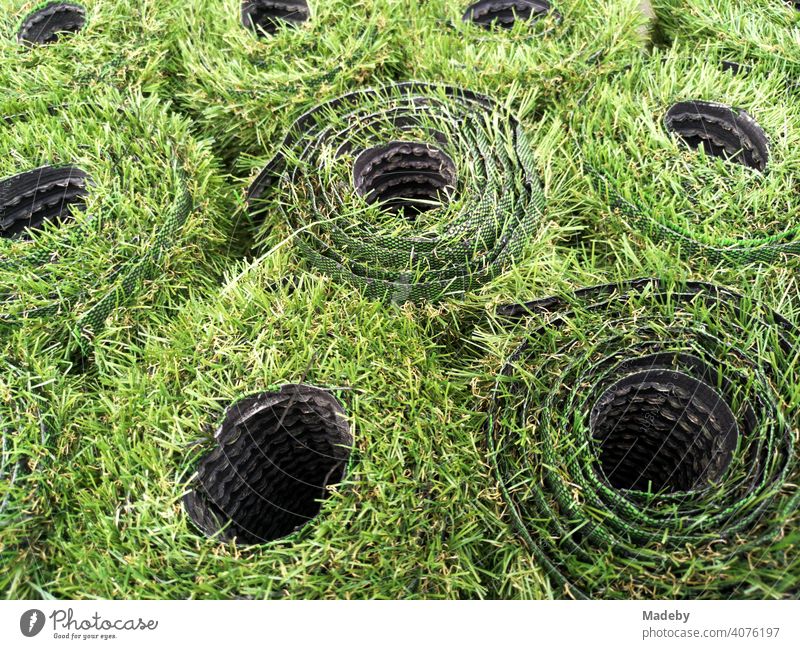 Set up green rolls with artificial grass for balcony or terrace in front of a shop at Hackescher Markt in summer in the capital Berlin Lawn Artificial lawn