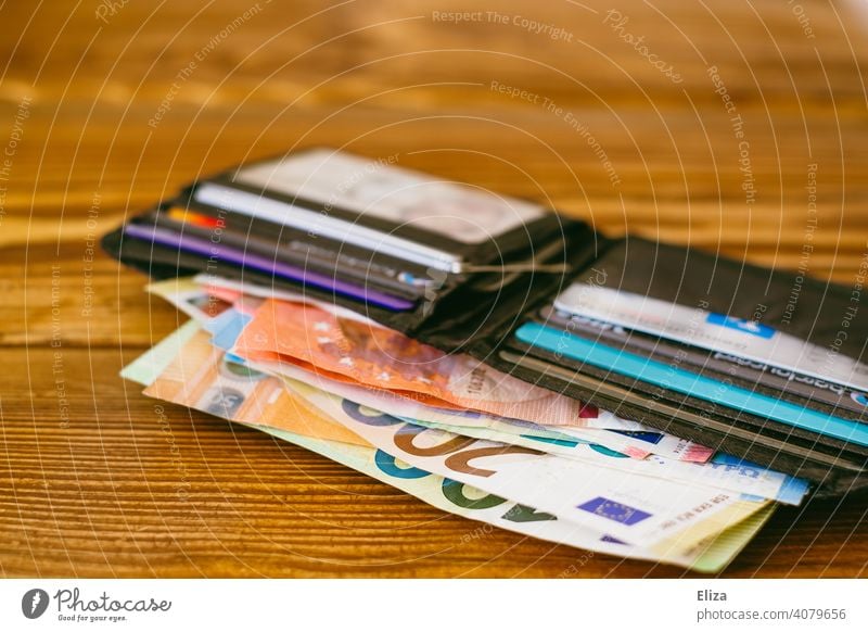 Many banknotes in one wallet Money Bank note Loose change Purse Rich Liquid Euro Euro notes finance Luxury Wallet Shopping figures Paying assets salary