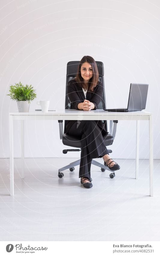 beautiful young Business woman working in the office, using her laptop. Business Concept.white backgrounds. Indoors computer worker businesswoman mobile