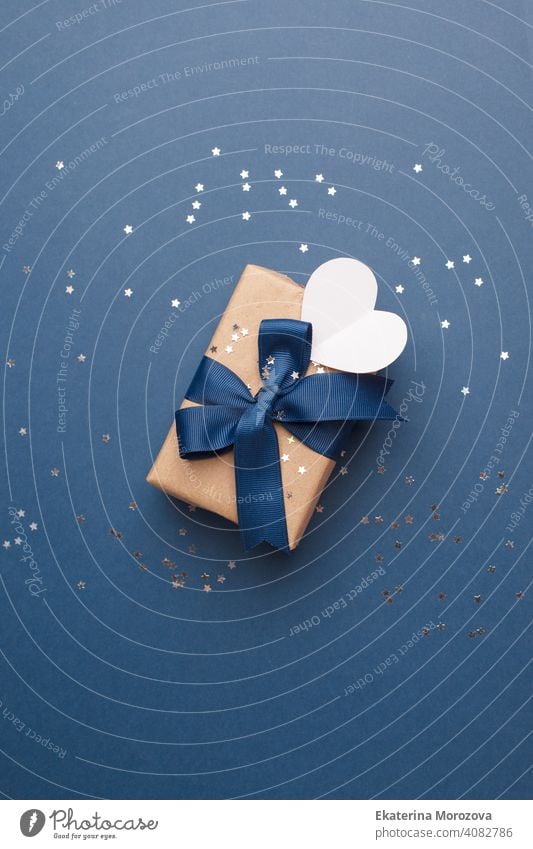 Blue theme craft gift box present gift with classic blue ribbon and white heart shape tag for Happy Fathers Day message, holiday, xmas, christmas 2021 banner, flyer, coupon