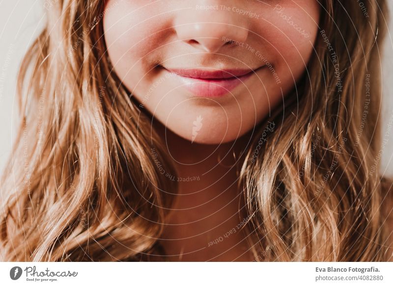 Portrait of unrecognizable teenager smiling girl at home. white background, close up view. Happiness and lifestyle concept child tourism smile happy people
