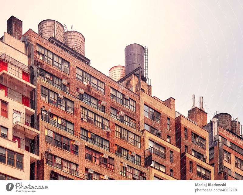 Water towers on New York buildings, color toning applied, USA. city water tower water tank cityscape Manhattan NYC apartment old symbol picture view day urban